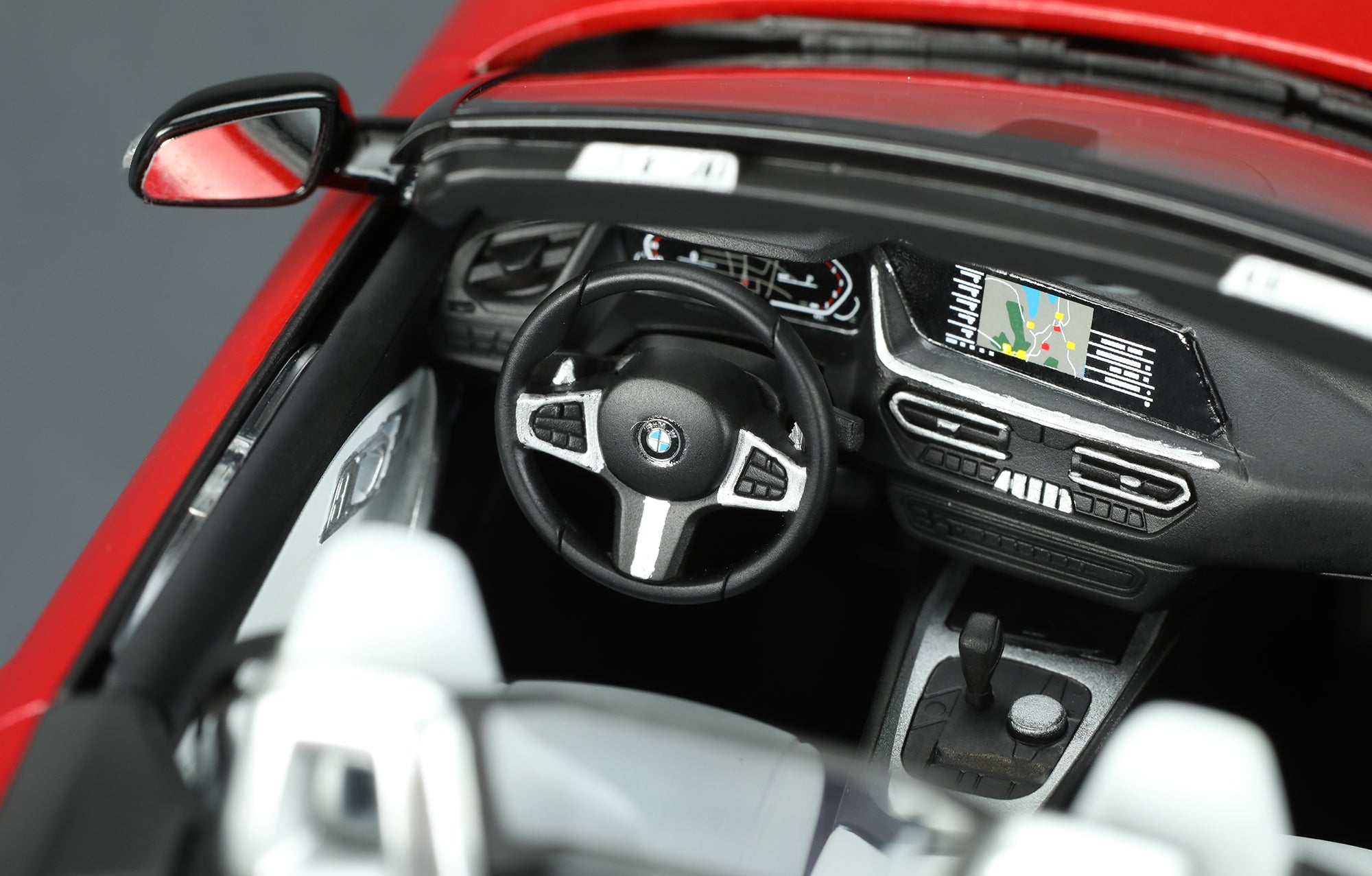 painted model - The BMW Z4 steering wheel and instrument panel have precision details. Rearview mirrors are replicated by reflective mirror foil.